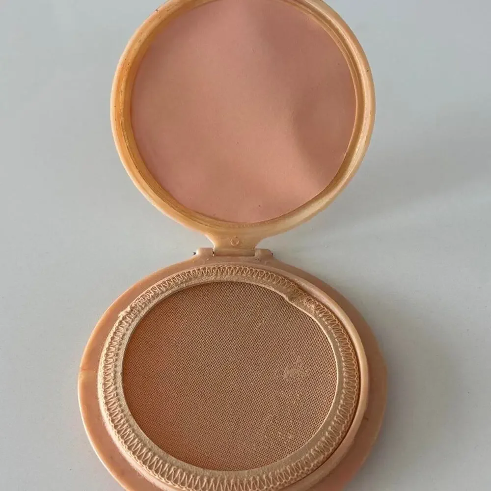 Vintage marbled blush powder compact with carved feather motif